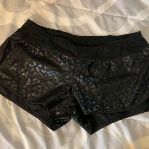 Pink black leopard print running shorts
